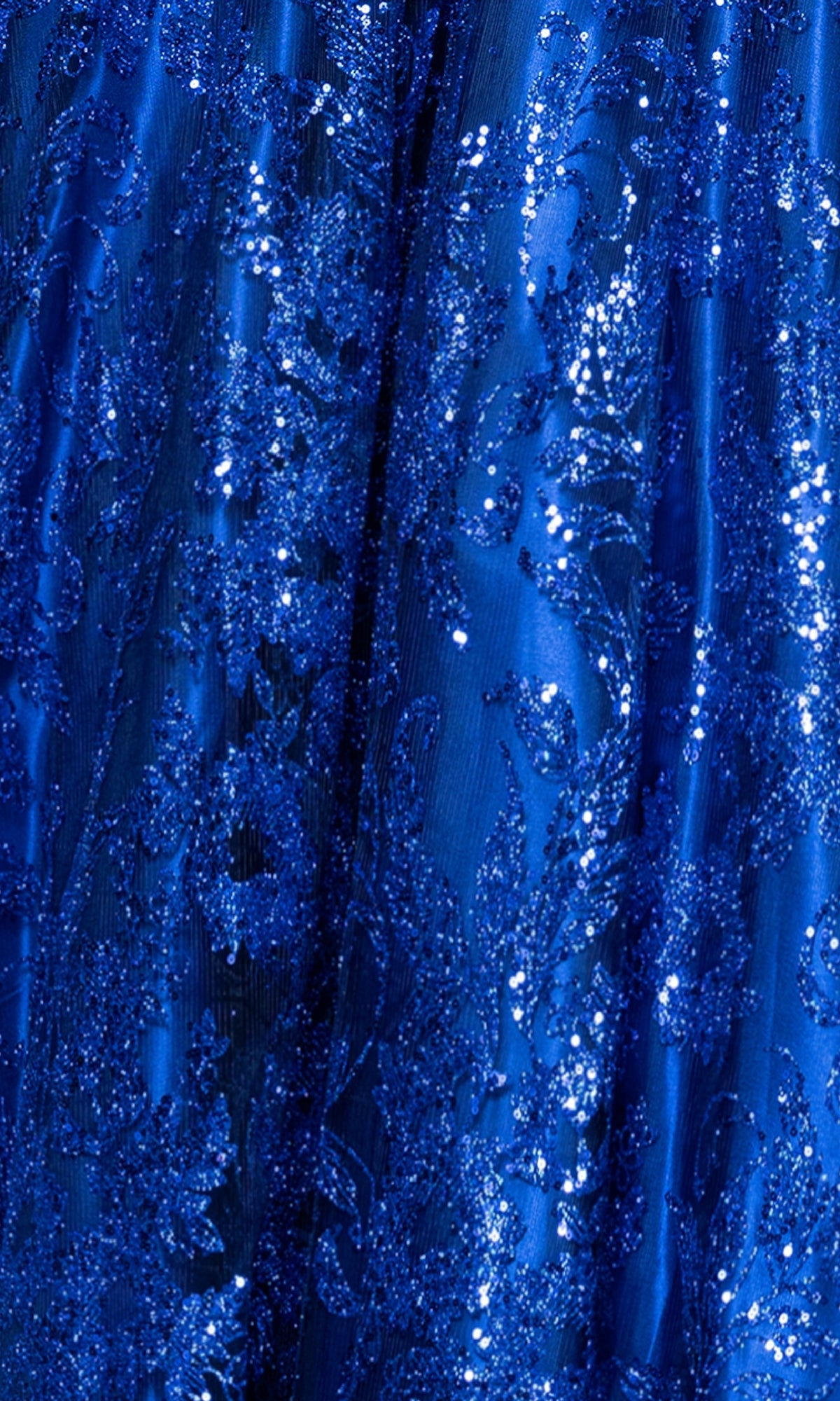 Close-up of the blue fabric on the Long Glitter Prom Dress: Blondie Nites 5501BN, featuring intricate sequin and embroidered patterns for a shiny, textured surface reminiscent of an elegant evening gown.